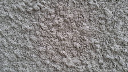 White knobby cement wall backgroudの写真素材