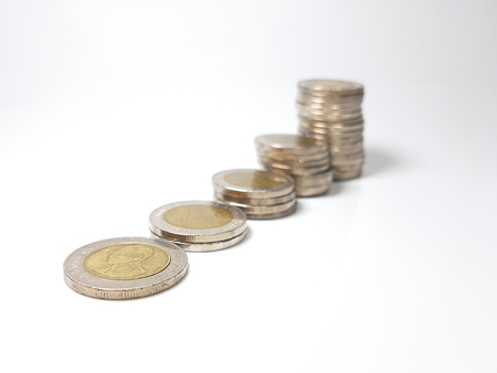Stack coin growth chart closed up on white backgroundの写真素材