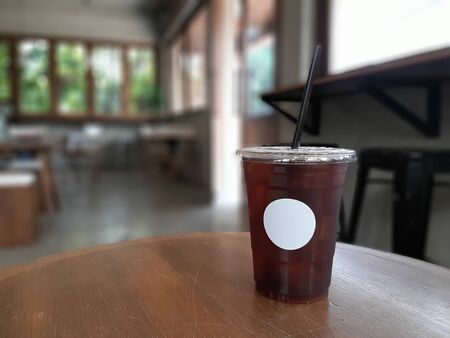 Iced black coffee stand on table in the coffee shopの写真素材