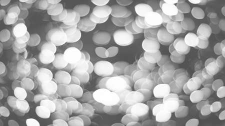 Black and white blurred Christmas tree lights backgroundの写真素材