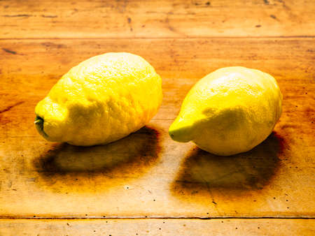 Two lemons on wooden backgroundの写真素材