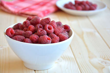 raspberries in the white bowlの写真素材