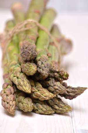 Fresh and delicious green asparagus on the white backgroundの写真素材
