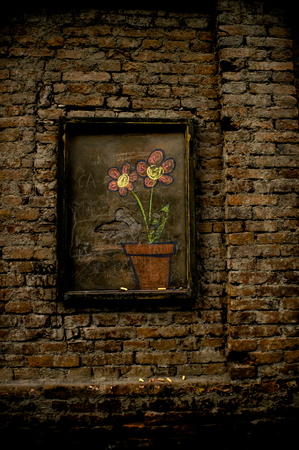 Flowers drawing on a brick wallの写真素材