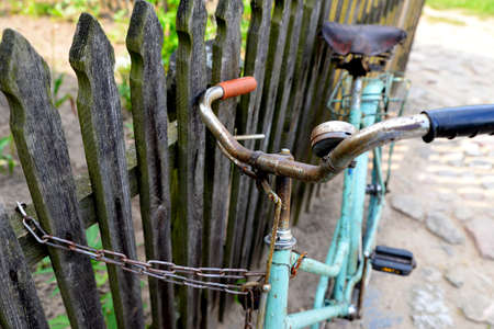 old blue bicycle theft-proofの写真素材