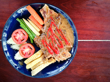 pork steak on the wood.の写真素材