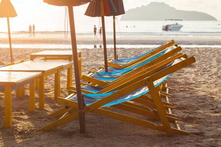 Beach chairs and umbrella on  ocean beach in morning.の写真素材