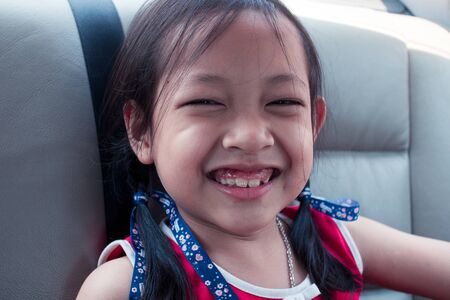 Portrait of attractive caucasian little asian girlの写真素材