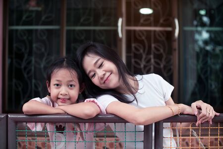 Asian mother and her mother smile at homeの写真素材