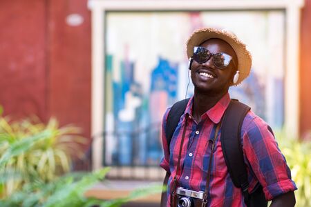 Tourist African man feel happy with travel place in scenery town.の写真素材