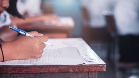 Student doing test or exam  in classroom of school with stress.16:9 styleの写真素材