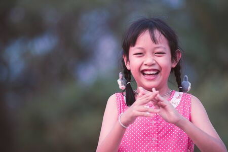 Portrait of happy smiling asian child girlの写真素材