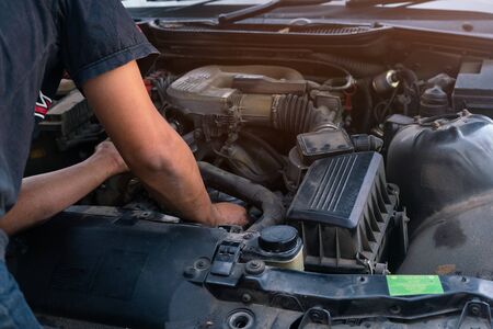 Car mechanic looking and analysis to repairing the engine in the garage