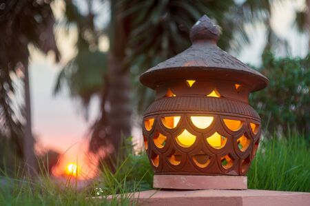 The lamp is switched on But the sun is leavingの写真素材