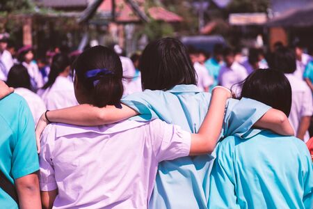 Asian uniform students hugging with love,Concept of best friends.の写真素材