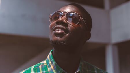 African man smiling worker in  shirt and eyeglasses.16:9 styleの写真素材