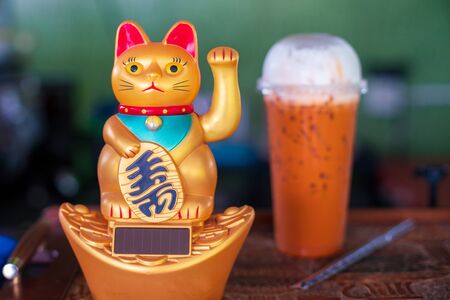 Maneki Neko, Japanese lucky cat, ingot mean symbols of good luckの写真素材