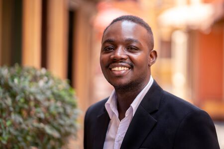 Smile African businessman  standing in the cityの写真素材