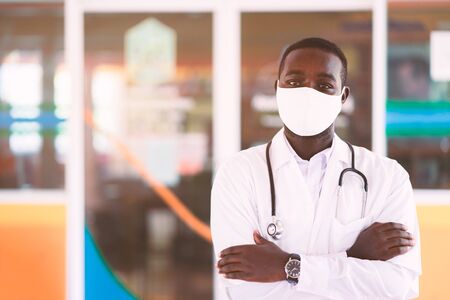 African doctor wear face mask and stethoscope with professional and  kindの写真素材