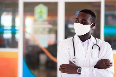 African doctor wear face mask and stethoscope with professional and  kindの写真素材