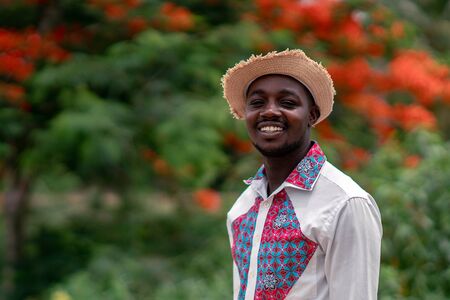 Portrait of african man wearing native cloth traditional colorful with smile and happy.の写真素材