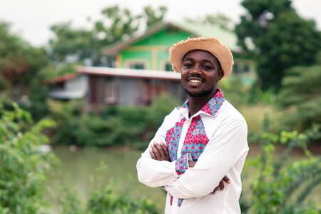 Portrait of african man wearing native cloth traditional colorful with smile and happy.の写真素材