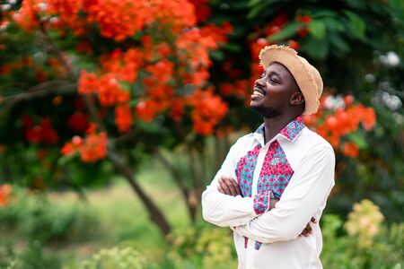 Portrait of african man wearing native cloth traditional colorful with smile and happy.の写真素材