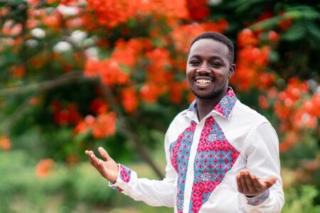 Portrait of african man wearing native cloth traditional colorful with smile and happy.の写真素材