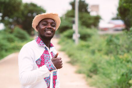 Portrait of african man wearing native cloth traditional colorful with smile and happy.の写真素材