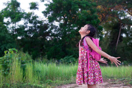 Freedom asian little girl with backpack.Back to school concept