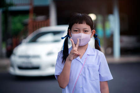 Asian uniform student wear face mask to protect Corona virus  or Covid-19.Back to school conceptの写真素材