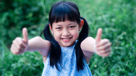 Portrait of a happy smiling asian child girl.16:9 styleの写真素材