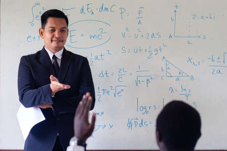 Asian teacher teaching science in the classroomの写真素材