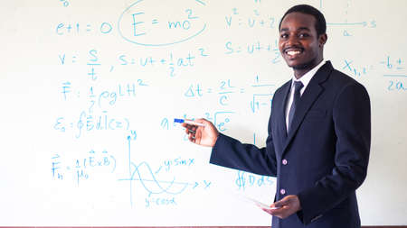African teacher teaching science in the classroomの写真素材