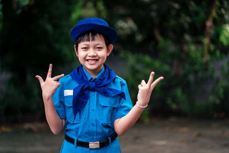 Beautiful uniform scout girl standing with happy and smile