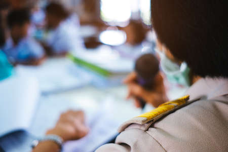 Asian government teacher uniform is teaching in the classroomの写真素材