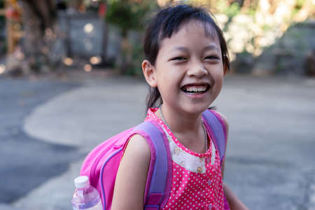 Happy smiling girl  going to school for the first timeの写真素材
