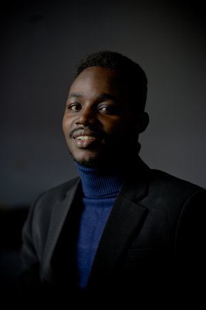 Retro african business man in black suit. Low key  styleの写真素材