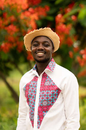 African man wearing native cloth traditional colorful with smile and happy