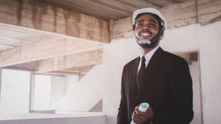 African architects engineer manager with tablet work together in the inside the construction...