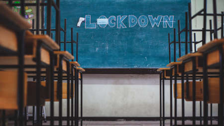 School closed due to COVID-19 outbreak and a message "Lockdown" was posted on the school blackboardの写真素材