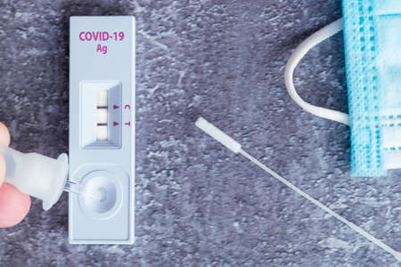 antigen self test for nasal swab with showing positive result. Medical device for virus test