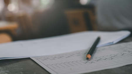 A pencil is placed on the answer sheet in the classroom where the student's exam is taking...