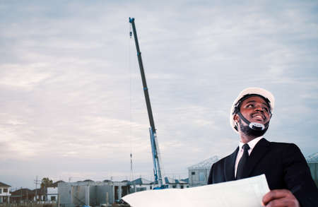 African architects engineer manager with tablet work together in the inside the construction building siteの写真素材