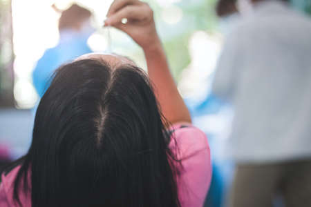 The man swab COVID-19 testing by ATK or Rapid Antigen Test kit  with a cotton nasal swabの写真素材