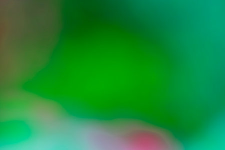 abstract background with green bokeh defocused lights and shadowの写真素材