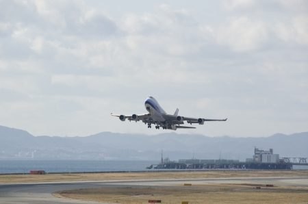 Boeing 747 plane starting at Kansai international airport in Osaka, Japanのeditorial素材