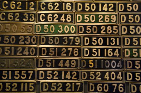 Golden train plates with type numbers of different steam trainsのeditorial素材