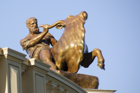 Sculpture of Hercules subduing the Cretan bull, in the gardens of the castle Schwerin, Germanyのeditorial素材