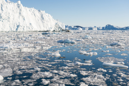 Beautiful Icebergs in Disko Bay Greenland around Ilulissat with blue sky
